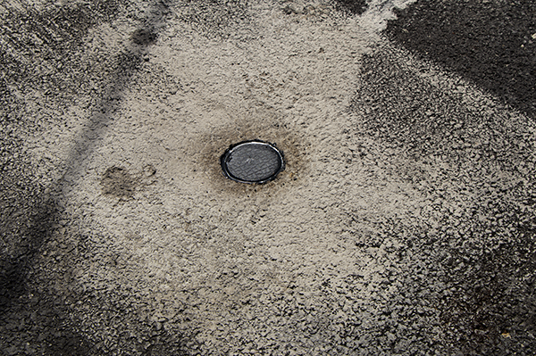 Image of parking sensor in Uptown parking space.