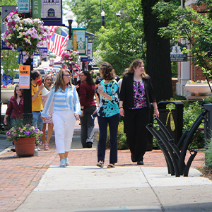 people walking in uptown news thumb